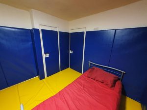 Colourful Padding in Bedroom on Wall, Floor and Doors